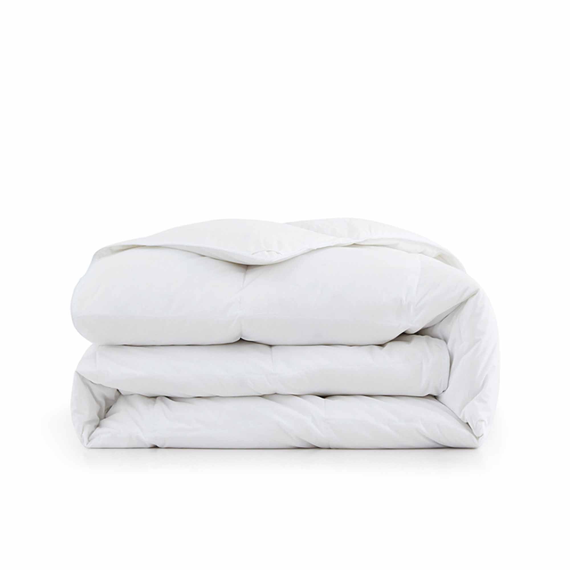 Fresh white tones are brushed over the all-size comforter. Add a touch of all-around luxurious warmth to your modern bedroom design with this down comforter with feathers.