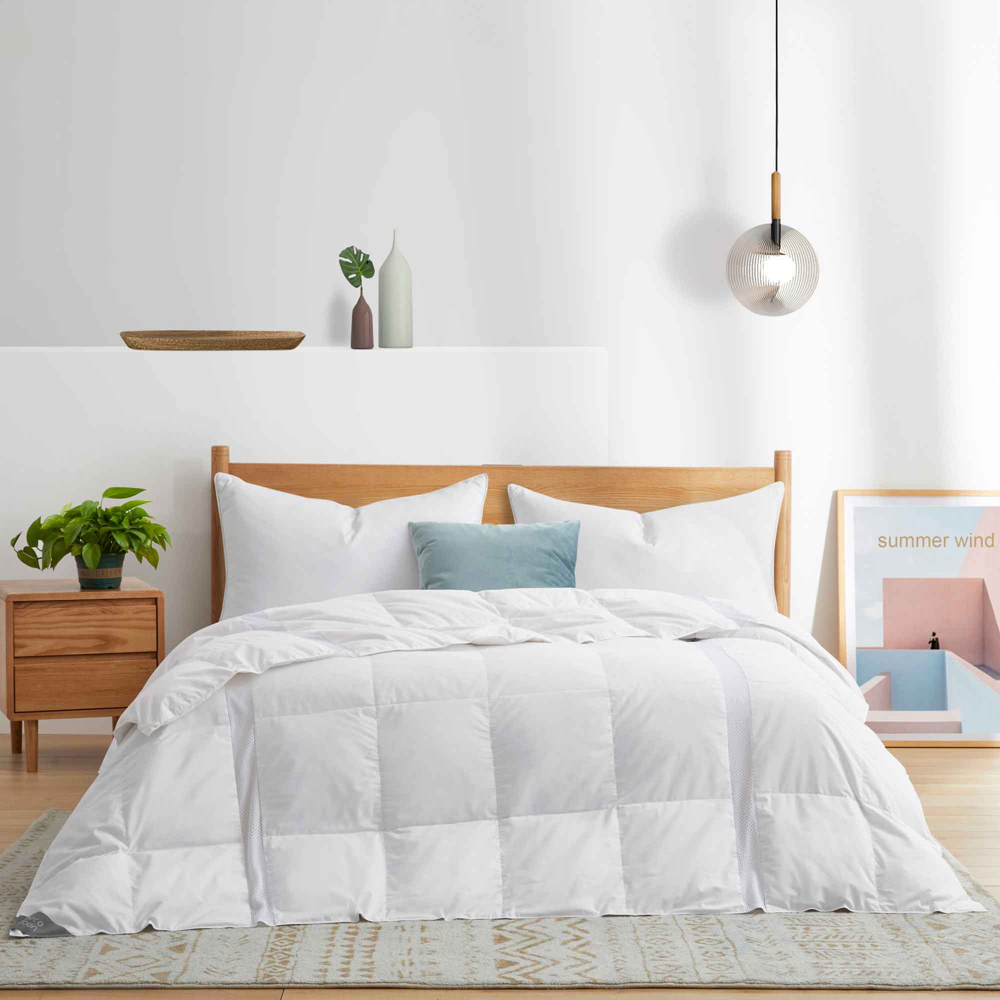 The lightweight summer comforters are brushed in the solid colors of white. Revel in a cloud of comfort in your modern bedroom design with this down blanket.
