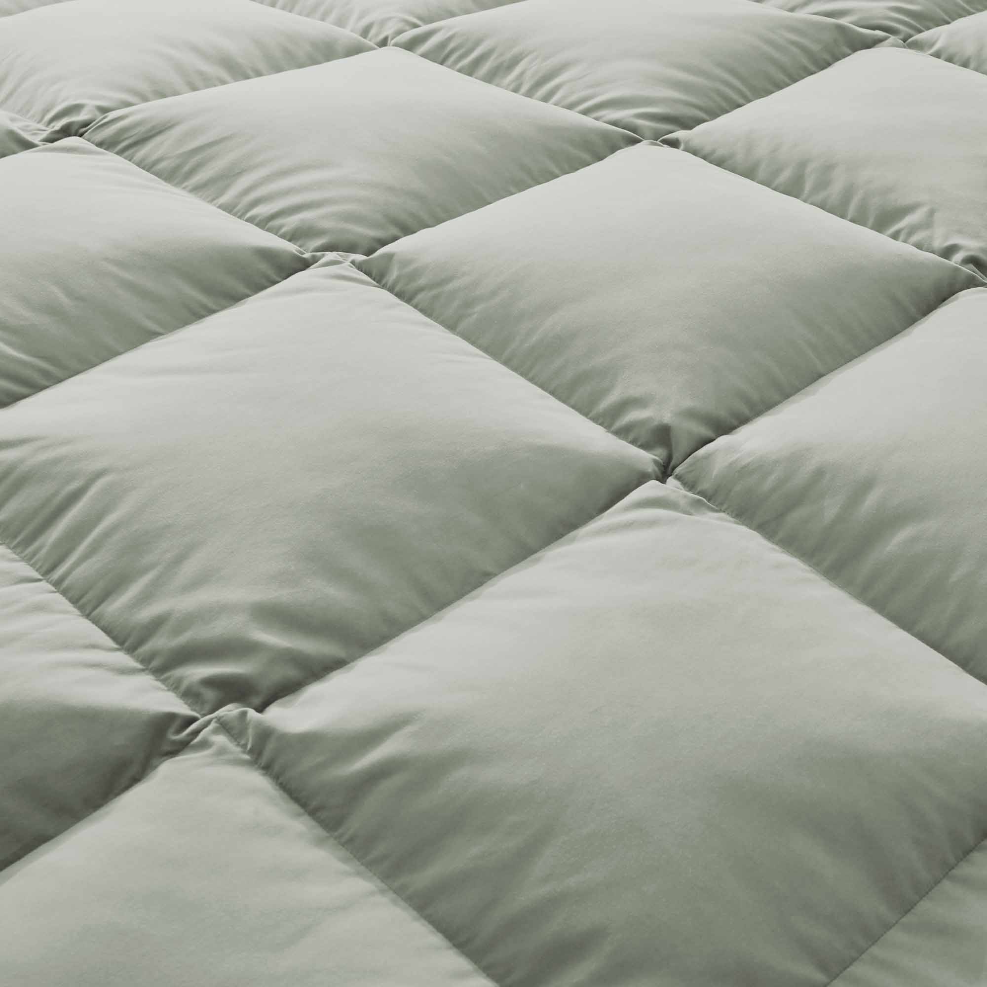Add a touch of nature to your bedroom with our Sage Green Goose Feather & Down Comforter. The calming green tone pairs beautifully with any decor, while the soft microfiber shell and breathable feather-down blend offer cozy, all-season comfort. A perfect mix of style and sleep-enhancing warmth.