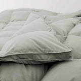 Add a touch of nature to your bedroom with our Sage Green Goose Feather & Down Comforter. The calming green tone pairs beautifully with any decor, while the soft microfiber shell and breathable feather-down blend offer cozy, all-season comfort. A perfect mix of style and sleep-enhancing warmth.