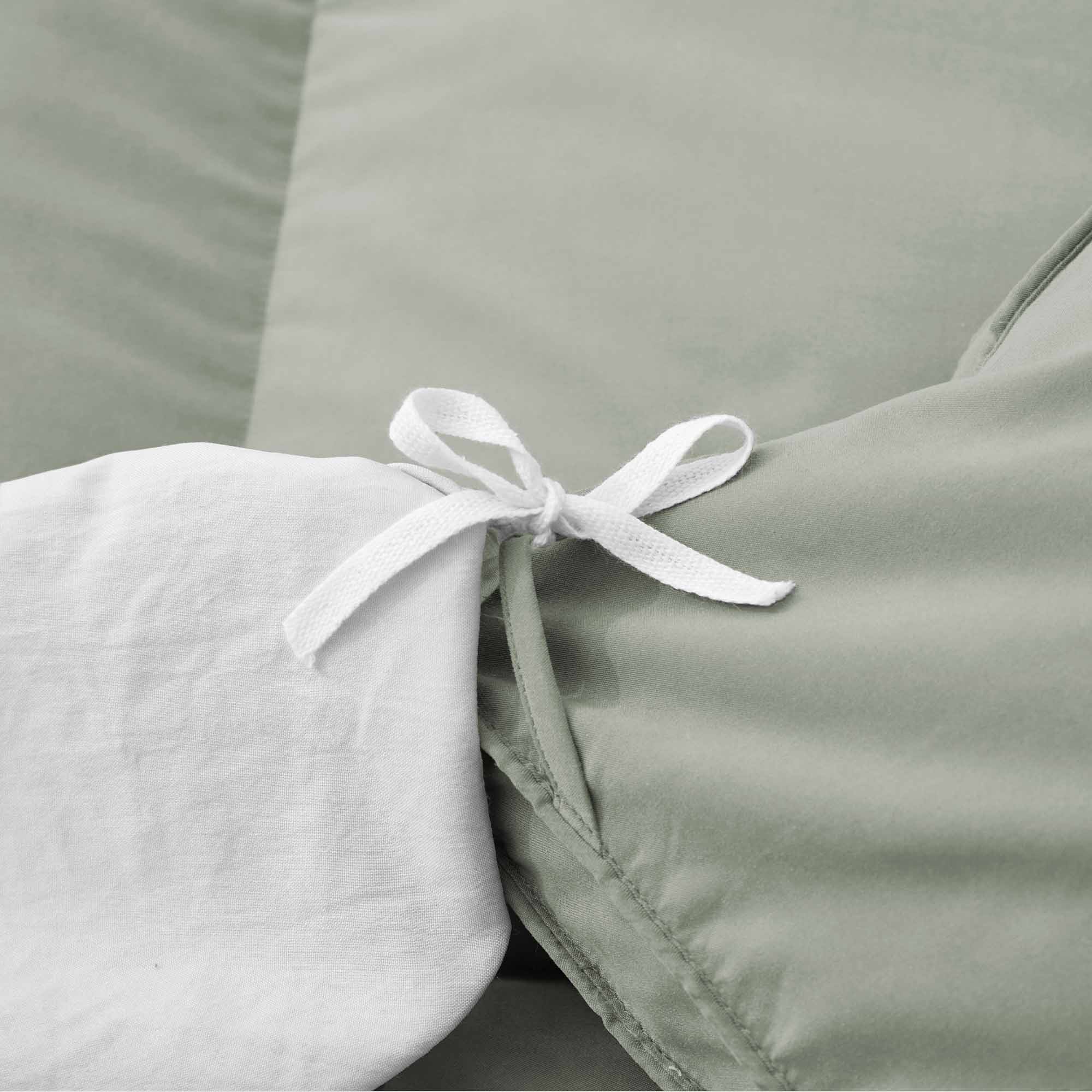 Add a touch of nature to your bedroom with our Sage Green Goose Feather & Down Comforter. The calming green tone pairs beautifully with any decor, while the soft microfiber shell and breathable feather-down blend offer cozy, all-season comfort. A perfect mix of style and sleep-enhancing warmth.