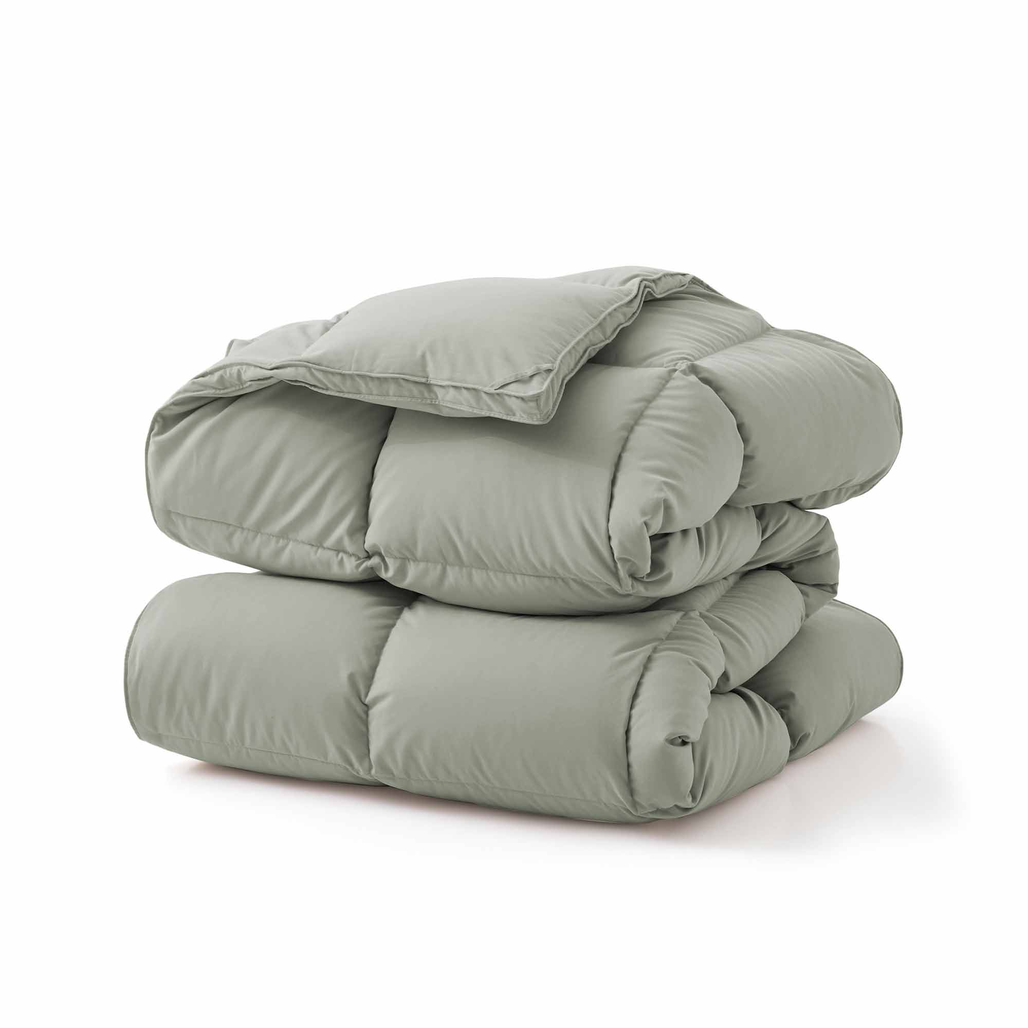Add a touch of nature to your bedroom with our Sage Green Goose Feather & Down Comforter. The calming green tone pairs beautifully with any decor, while the soft microfiber shell and breathable feather-down blend offer cozy, all-season comfort. A perfect mix of style and sleep-enhancing warmth.