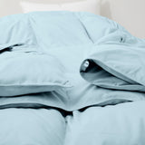 The down comforter with feathers is enveloped in the pristine shades of Sky Blue. Enjoy a cloud-like experience for a cozy sleep with this superior quality down feather comforter with duvet ties.