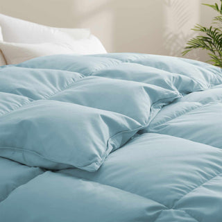 The down comforter with feathers is enveloped in the pristine shades of Sky Blue. Enjoy a cloud-like experience for a cozy sleep with this superior quality down feather comforter with duvet ties.