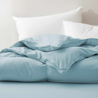 The down comforter with feathers is enveloped in the pristine shades of Sky Blue. Enjoy a cloud-like experience for a cozy sleep with this superior quality down feather comforter with duvet ties.