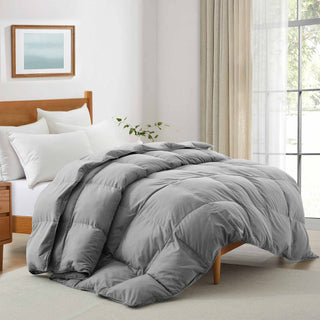 The stand-alone comforter is colored in rich tones of whale grey. Add a touch of millennial flair to your personal space with this feather fiber down comforter.