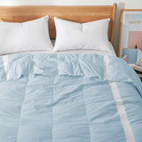 The luxurious comforter with corner tabs is enveloped in the cool tones of Sky Blue. Bring the icy cool freshness of the outdoors to your personal space with this feather down blanket.