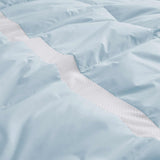 The luxurious comforter with corner tabs is enveloped in the cool tones of Sky Blue. Bring the icy cool freshness of the outdoors to your personal space with this feather down blanket.
