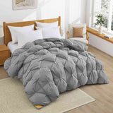 The medium warmth fluffy comforter is covered in the somber tones of gray. Add a touch of panache to your personal space with this high-quality all-season down comforter with corner taps for a snug sleep experience.