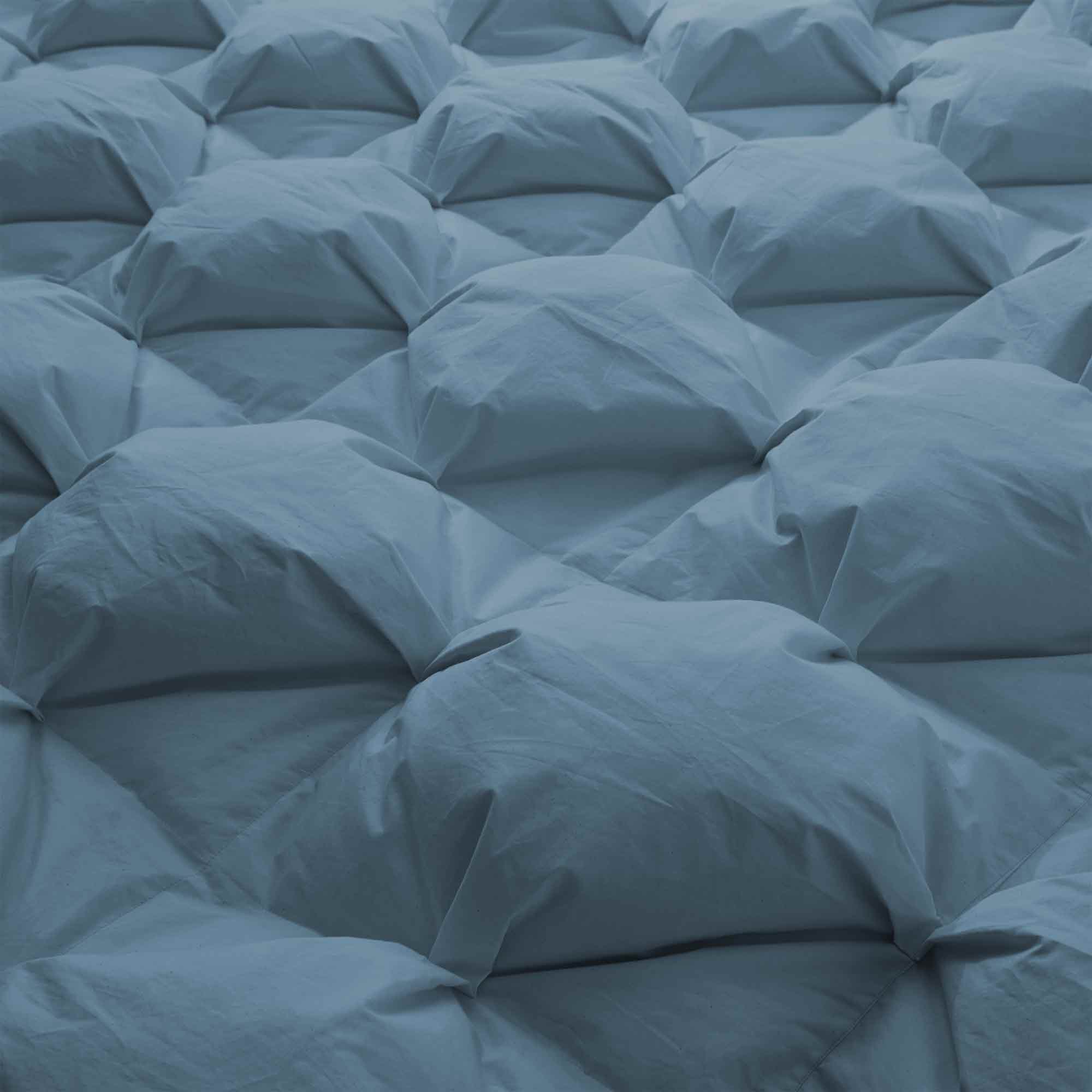 The organic cotton fabric cover comforter is brushed in the serene tones of Castle Blue. Bring an elevated level of warmth and fluffy comfort to your abode with this perfect weight comforter for a relaxing sleep experience.