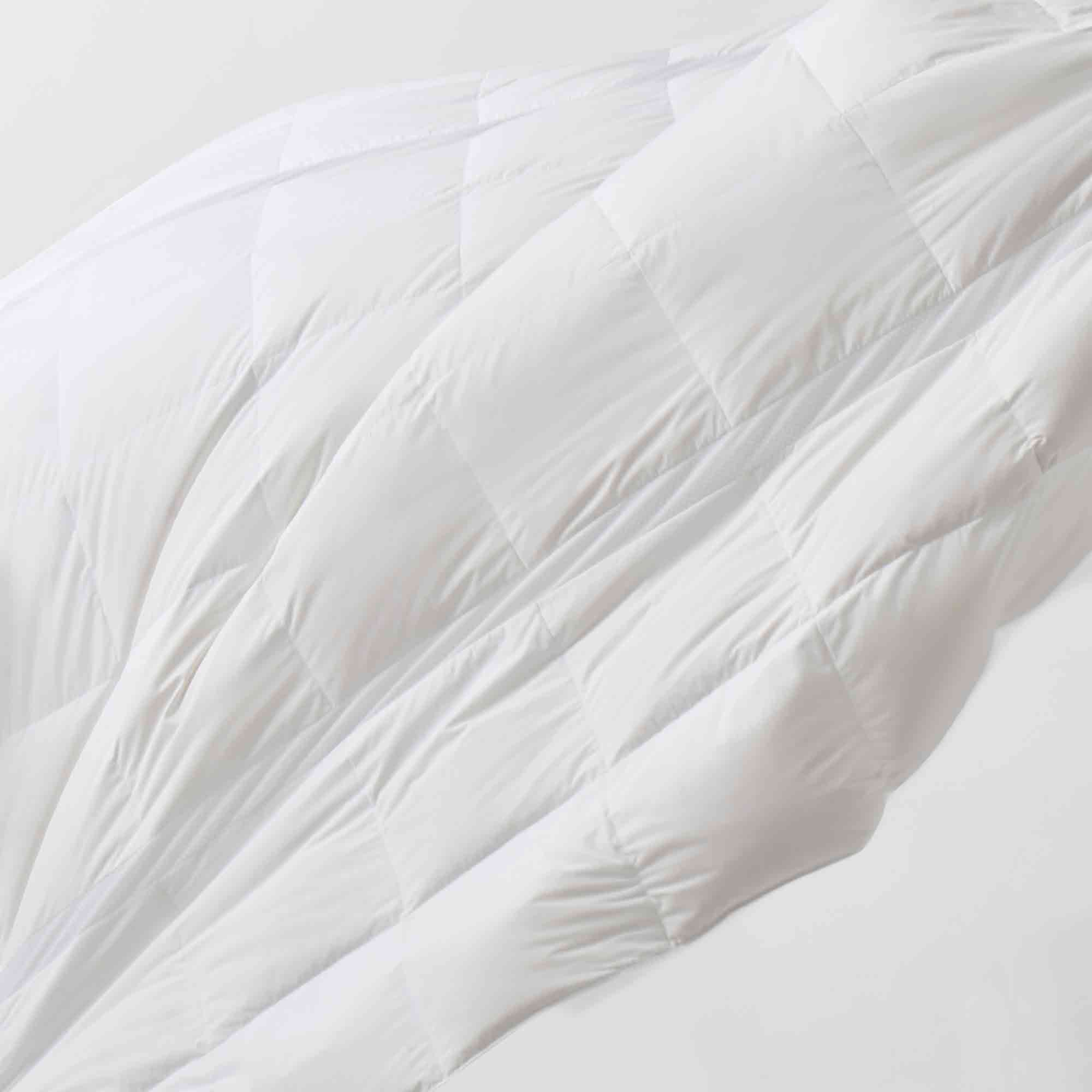 The lightweight summer comforters are brushed in the solid colors of white. Revel in a cloud of comfort in your modern bedroom design with this down blanket.