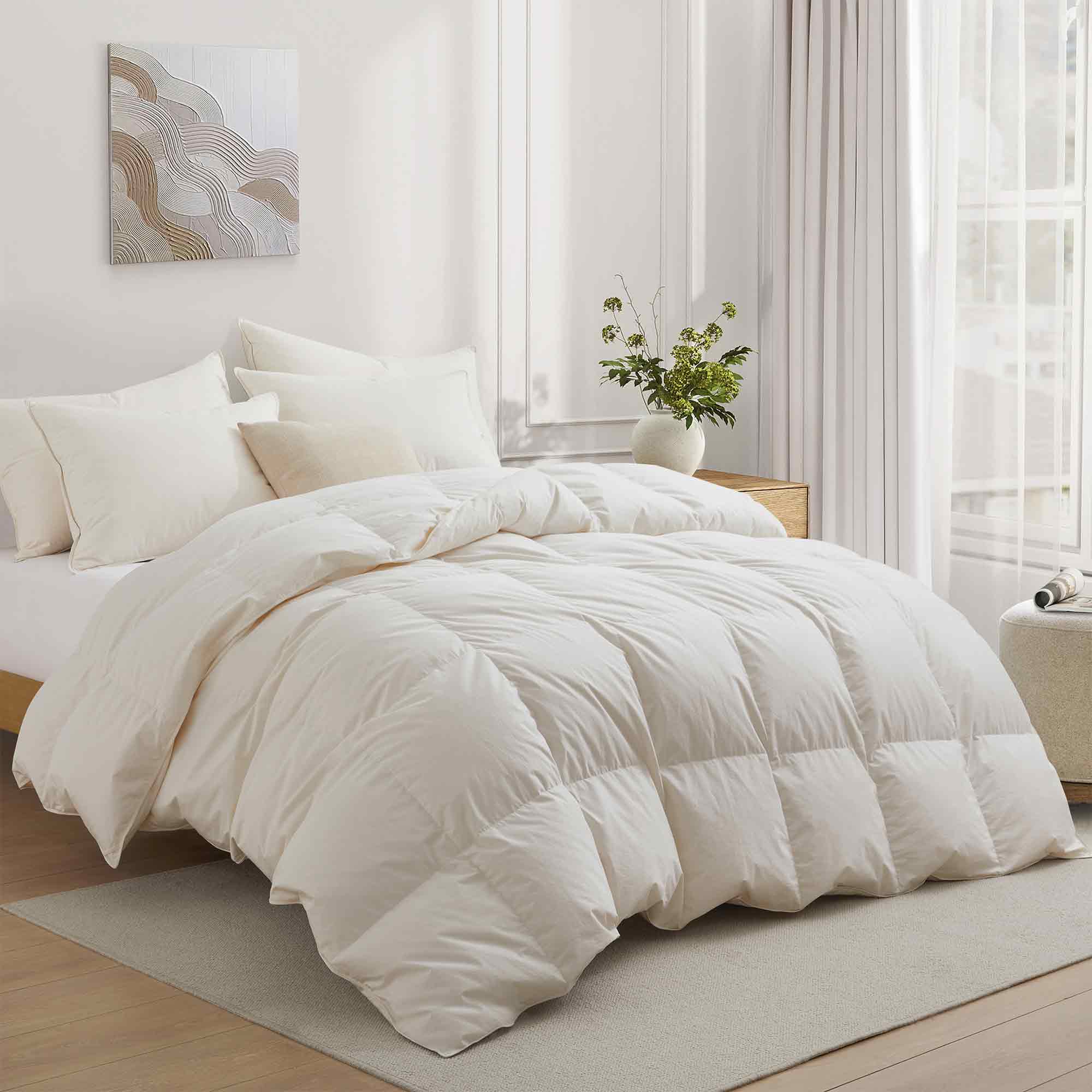 Crafted with a 100% organic cotton shell and filled with 90% natural white down, this comforter offers superior warmth and breathability. Its 800 fill power ensures a lightweight yet insulating sleep experience. Designed for year-round comfort, it features baffle box construction to maintain even fill distribution. Available in all-season and extra warm options, this comforter combines eco-friendly materials with luxurious softness for a restful night's sleep.