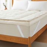 The plush surface of this feather blend mattress down topper is colored in pearly hues of off-white. Adding this feather mattress topper to your bedroom is an excellent choice for deep cushioning and additional comfort layer for a healthy sleep environment.