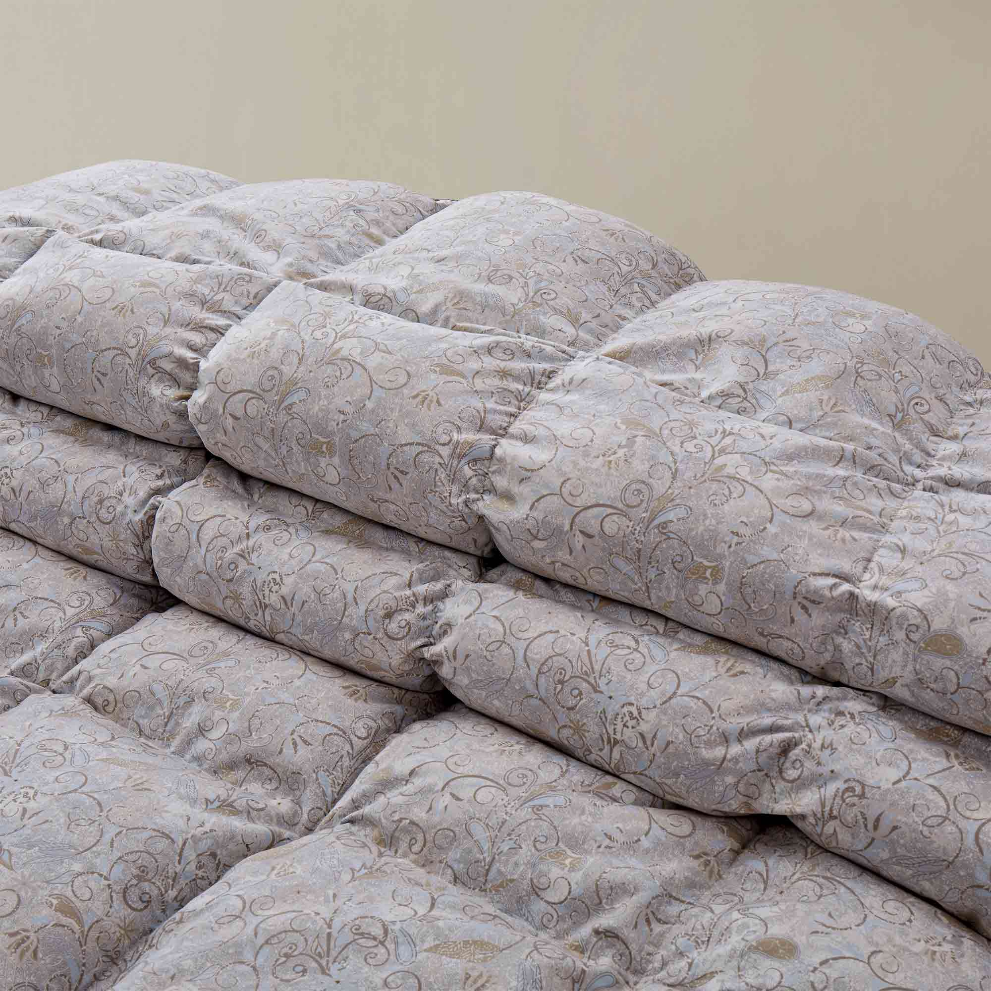 Elevate your bedding with the elegant Paisley Pattern Goose Feather & Down Comforter, designed with a soft microfiber shell for a smooth, cozy feel. The intricate paisley print adds a sophisticated touch to your bedroom, while the breathable feather and down fill provides lightweight warmth for comfortable sleep in every season.