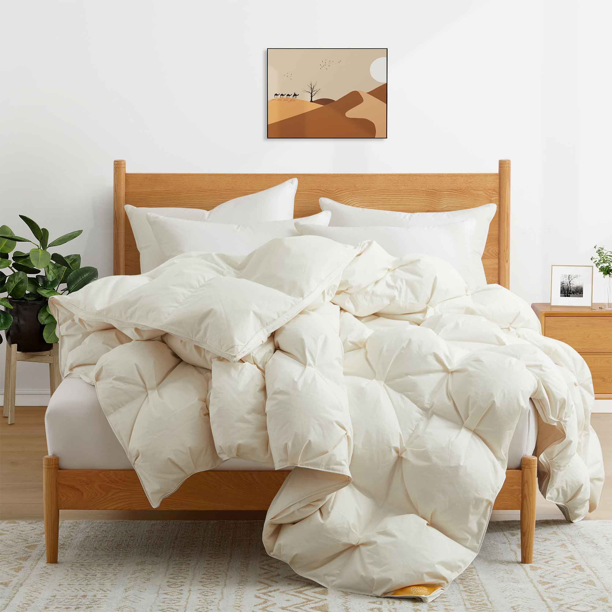 The down comforter is brushed in the pearly tones of off-white. Bring sophisticated elegance to your bedroom decor with this off-white bed comforter.