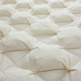 The down goose feather comforter is brushed in the pearly tones of off-white. Bring sophisticated elegance to your bedroom decor with this off-white bed comforter.