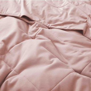 The down alternative comforter is brushed in the exquisite tones of pink. Feel the gentle embrace of sweetness and whimsy with the pink comforter for an exquisite touch to your space.