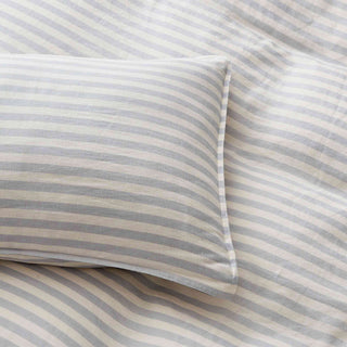 This linen bedding is covered in a refined gray and white textured stripe pattern. Experience the seamless blend of sophistication and simplicity with this gray stripe linen duvet cover set.