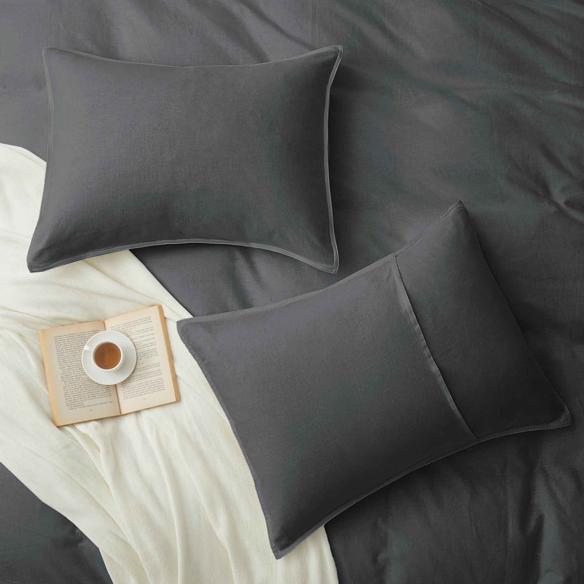 Deep charcoal gray duvet cover and pillowcases made from soft linen-cotton blend.