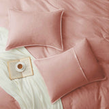 Soft rose taupe linen-cotton duvet cover and pillowcases in muted pink-beige.
