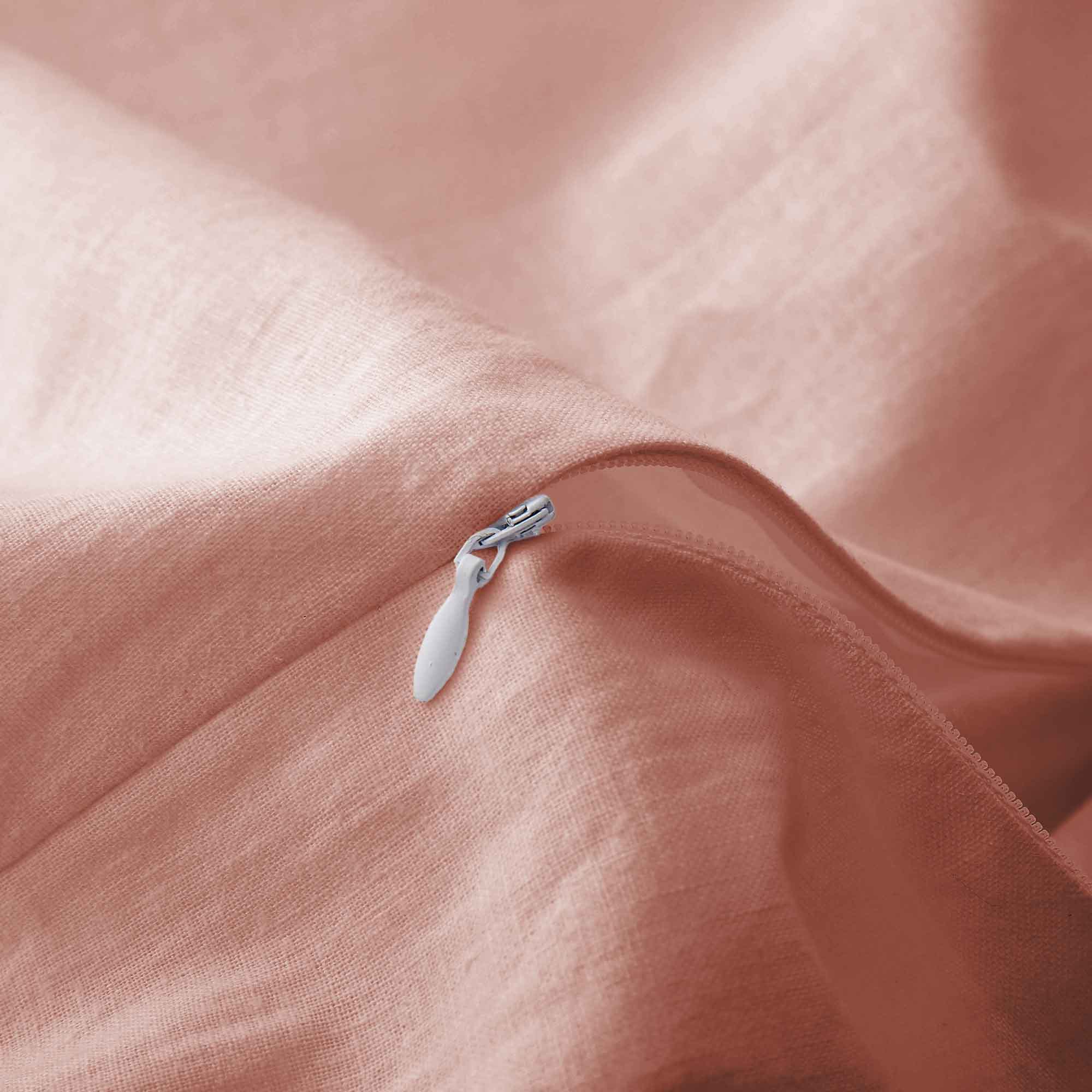 Soft rose taupe linen-cotton duvet cover and pillowcases in muted pink-beige.