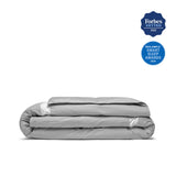 Elevate your sleep experience with the Ultra Lightweight Cooling Down Comforter in sleek gray—a perfect blend of style, breathability, and lightweight warmth. Tailored for hot sleepers and warm climates, this down comforter features cooling mesh fabric and a premium cover that promotes airflow and moisture-wicking to keep you comfortably dry all night