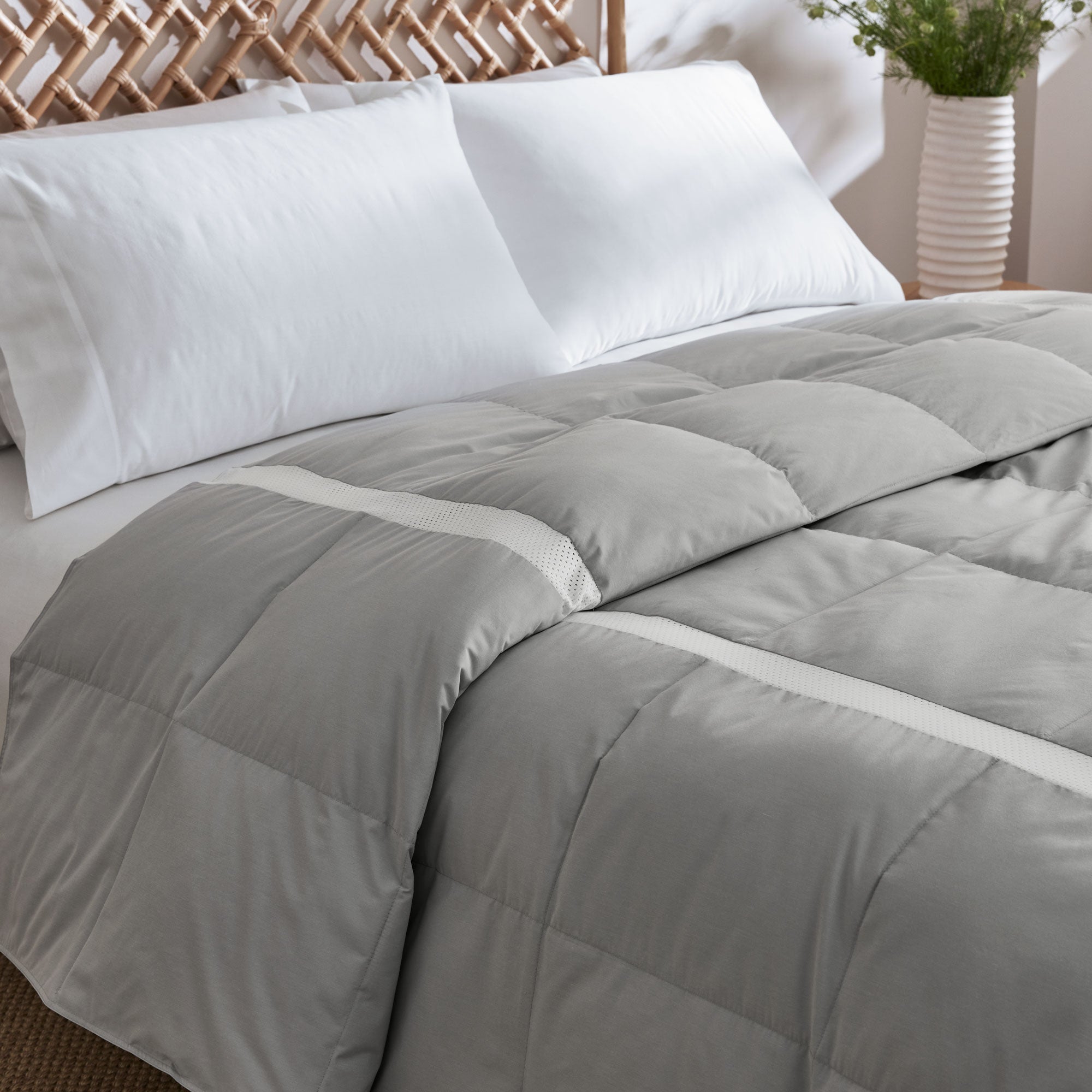 Elevate your sleep experience with the Ultra Lightweight Cooling Down Comforter in sleek gray—a perfect blend of style, breathability, and lightweight warmth. Tailored for hot sleepers and warm climates, this down comforter features cooling mesh fabric and a premium cover that promotes airflow and moisture-wicking to keep you comfortably dry all night