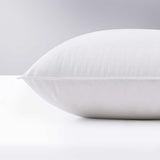 Made with down in pillows with feathers, this german down feather pillow is covered in crisp white hues. Add a touch of classic intrigue to your bedspace with this down feather pillow in white.