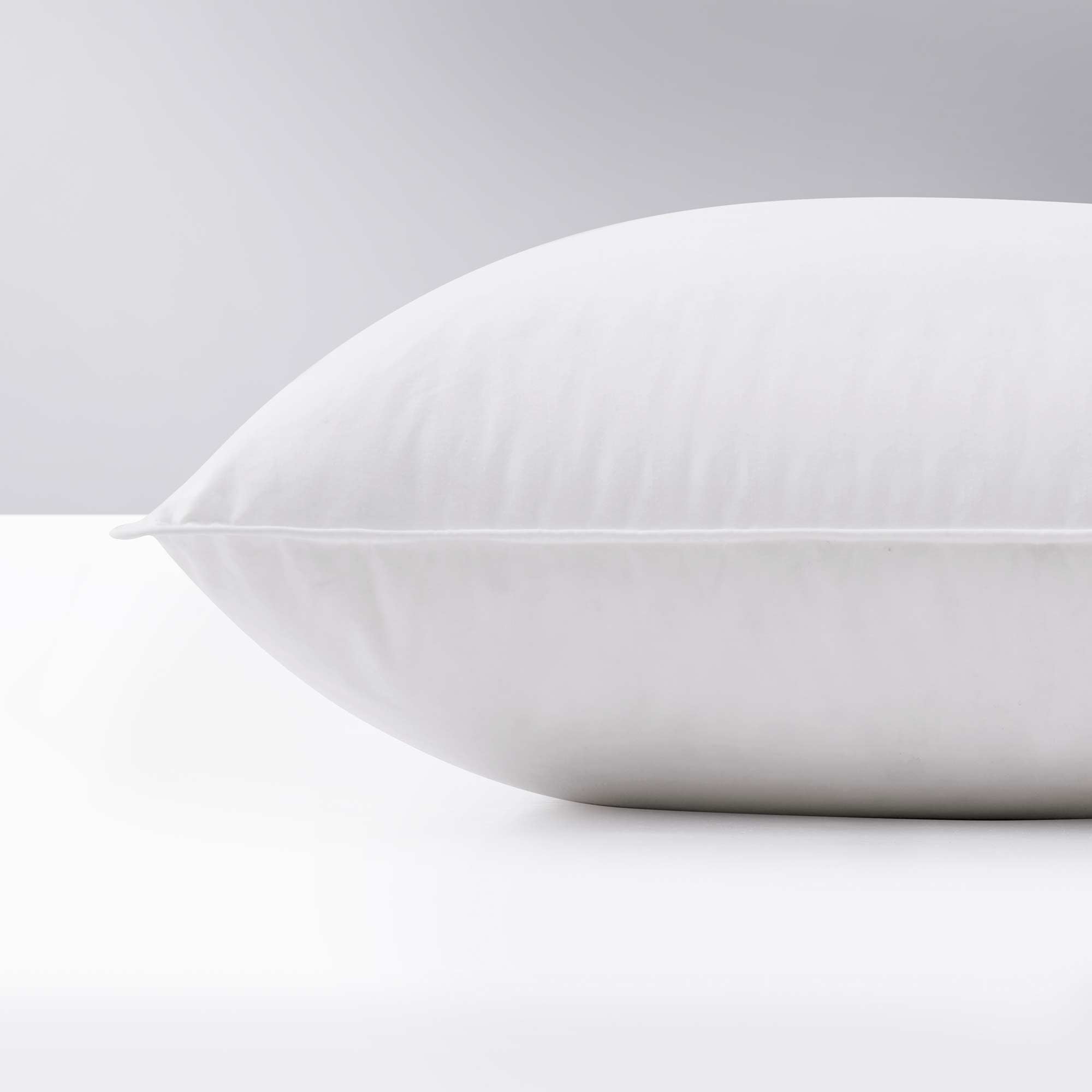 Made with down in pillows with feathers, this german down feather pillow is covered in crisp white hues. Add a touch of classic intrigue to your bedspace with this down feather pillow in white.