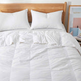 The lightweight summer comforters are brushed in the solid colors of white. Revel in a cloud of comfort in your modern bedroom design with this down blanket.