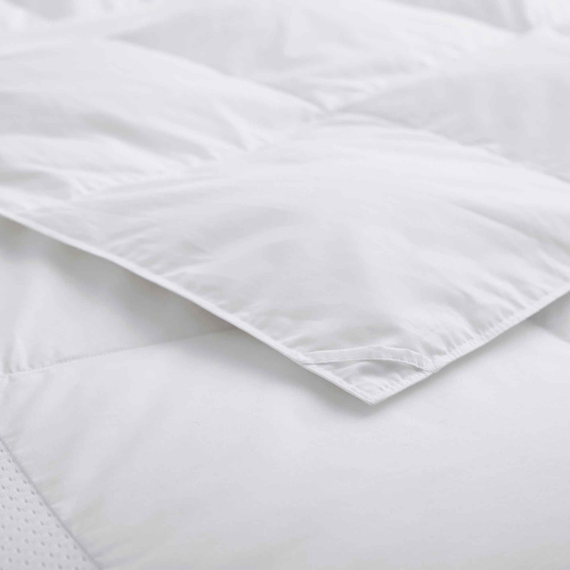 The lightweight summer comforters are brushed in the solid colors of white. Revel in a cloud of comfort in your modern bedroom design with this down blanket.