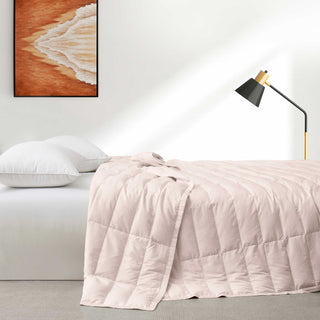 The down blanket is brushed in soft tones of pink. Add a touch of subtle beauty to your room with this cooling tencel lyocell blanket.