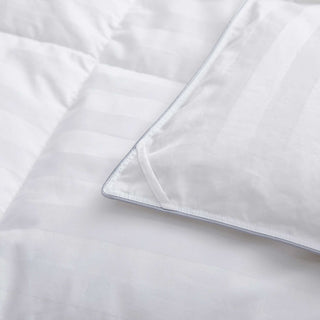 The goose down comforter is encased in soft white shades. Bring a millennial vibe and endless comfort to your bedroom with this goose down feather comforter.