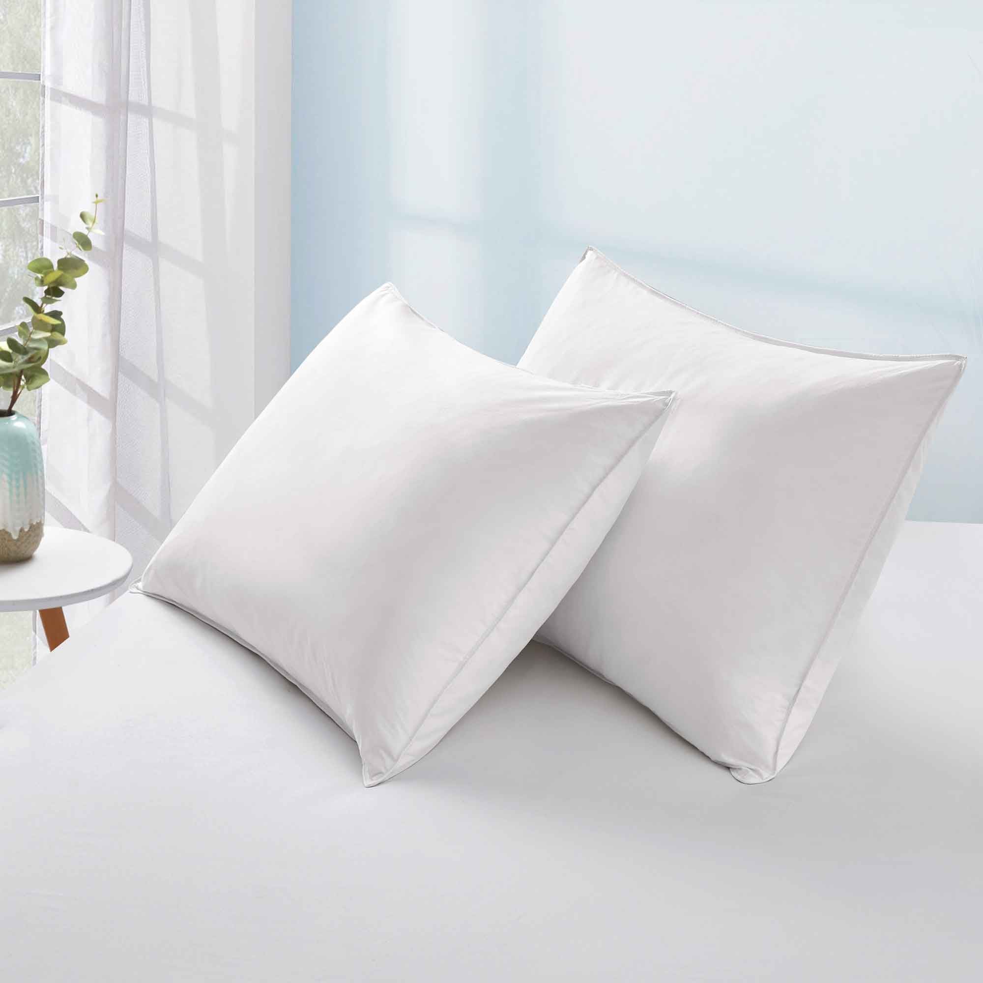 The plush pillow design is colored in the harmonious tones of white. Add a welcoming feel and luxurious comfort to your bedroom space with these overstuffed feather pillows.