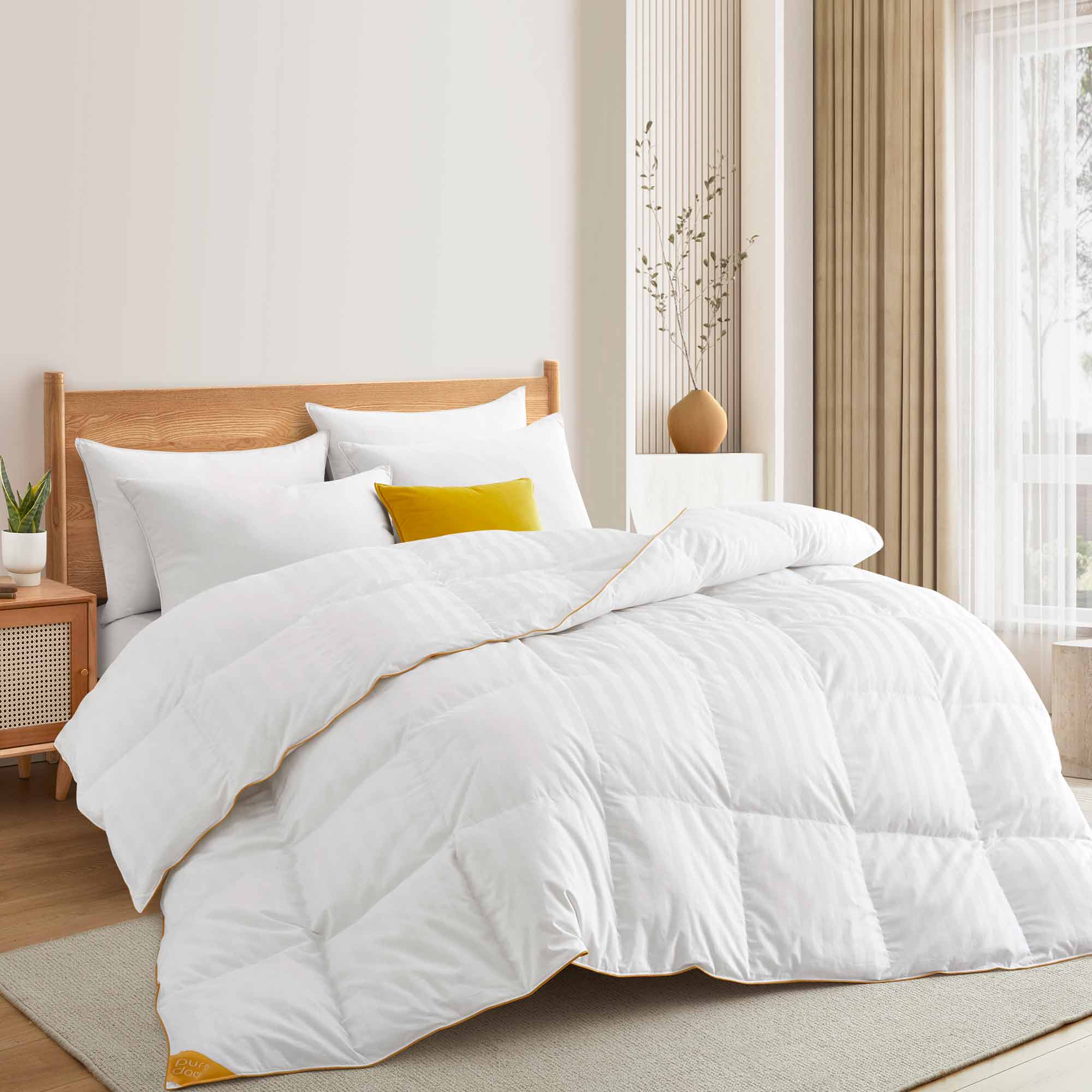 The all season down comforter is covered in the solid color of white. Add brightness and light to your room with this goose-down comforter.