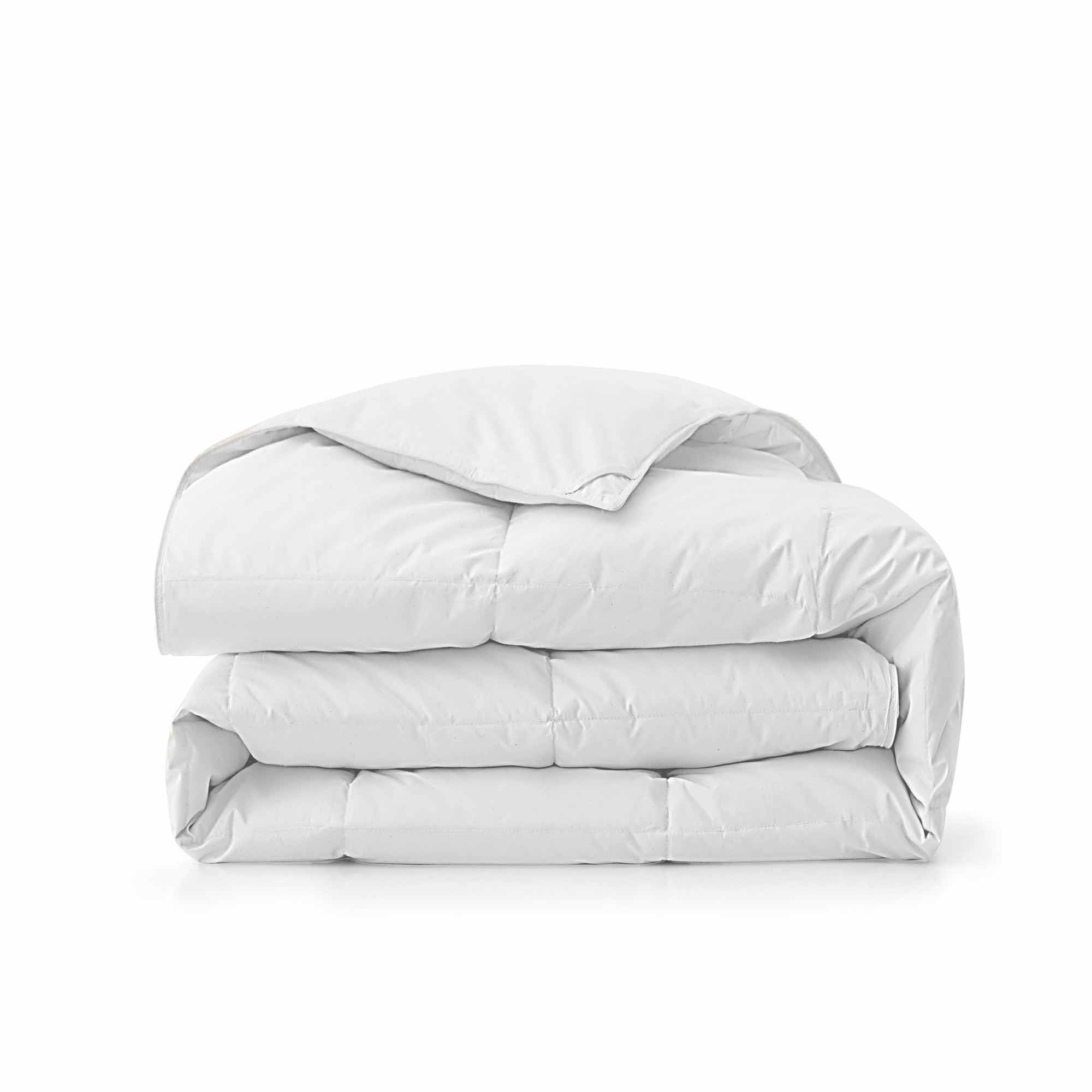 Experience timeless comfort with our White Organic Cotton Down Comforter — a must-have for those who value clean, classic bedding. Crafted from GOTS-certified organic cotton and filled with 100% down and feather fiber, this breathable and lightweight comforter is perfect for all-season use. The crisp white color creates a fresh, hotel-quality look while offering unmatched softness and natural temperature regulation. Whether styled alone or layered with other bedding, this white comforter elevates any bedroo