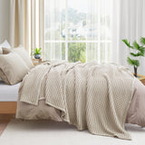 The all-weather blanket is covered in a beige color with soft camel undertones. Add a dimensional texture to your modern home décor with this perfectly pretty warm-season blanket for comfort.
