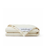 A folded cream-colored Woven Stripe Down Blanket with a Puredown Selected label is displayed on a white background.