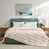 The down blanket is brushed in soft tones of pink. Add a touch of subtle beauty to your room with this cooling tencel lyocell blanket.