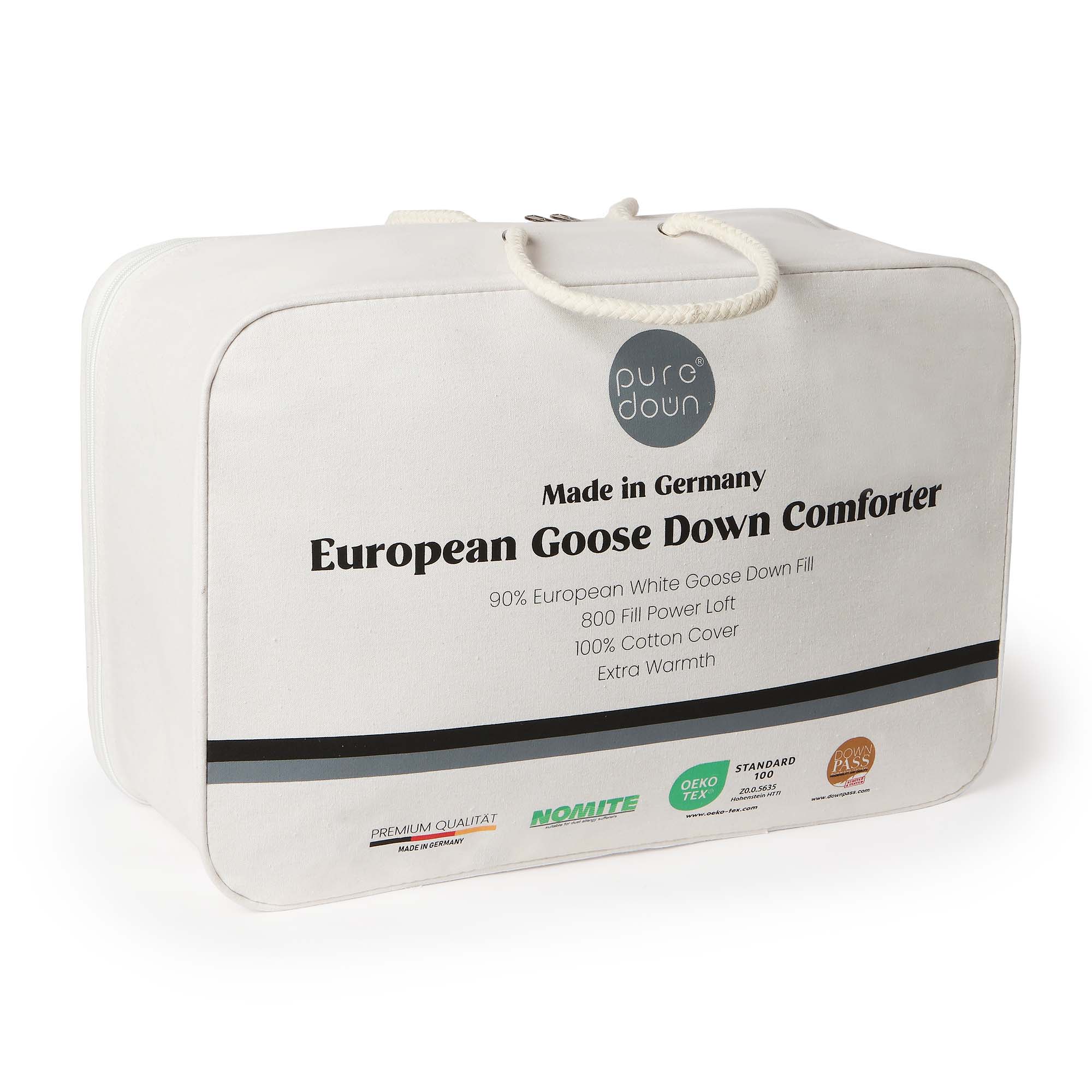 Crafted in Germany, this luxury down comforter features 90% white duck down in the medium weight and 90% white goose down in the extra warm version. With a soft, down-proof cotton shell and baffle box construction, it offers breathable warmth, even fill, and premium comfort—perfect for year-round or cold weather use.