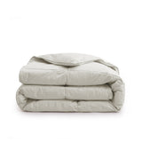 Add natural warmth and texture to your bedroom with our Oatmeal Organic Cotton Down Comforter. The soft, earthy oatmeal tone brings a calming, neutral aesthetic that blends effortlessly with modern, rustic, or minimalist decor. Made with GOTS-certified organic cotton and filled with 100% down and feather fiber, this comforter delivers breathable, all-season comfort with a cloud-like feel. Lightweight yet cozy, it's perfect for year-round use, offering natural insulation and moisture-wicking properties to he