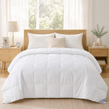 Cozy bed with hotel-inspired bedding, a Cotton Oversized Down Blanket, wooden frame, two nightstands, and a window with sheer curtains behind.