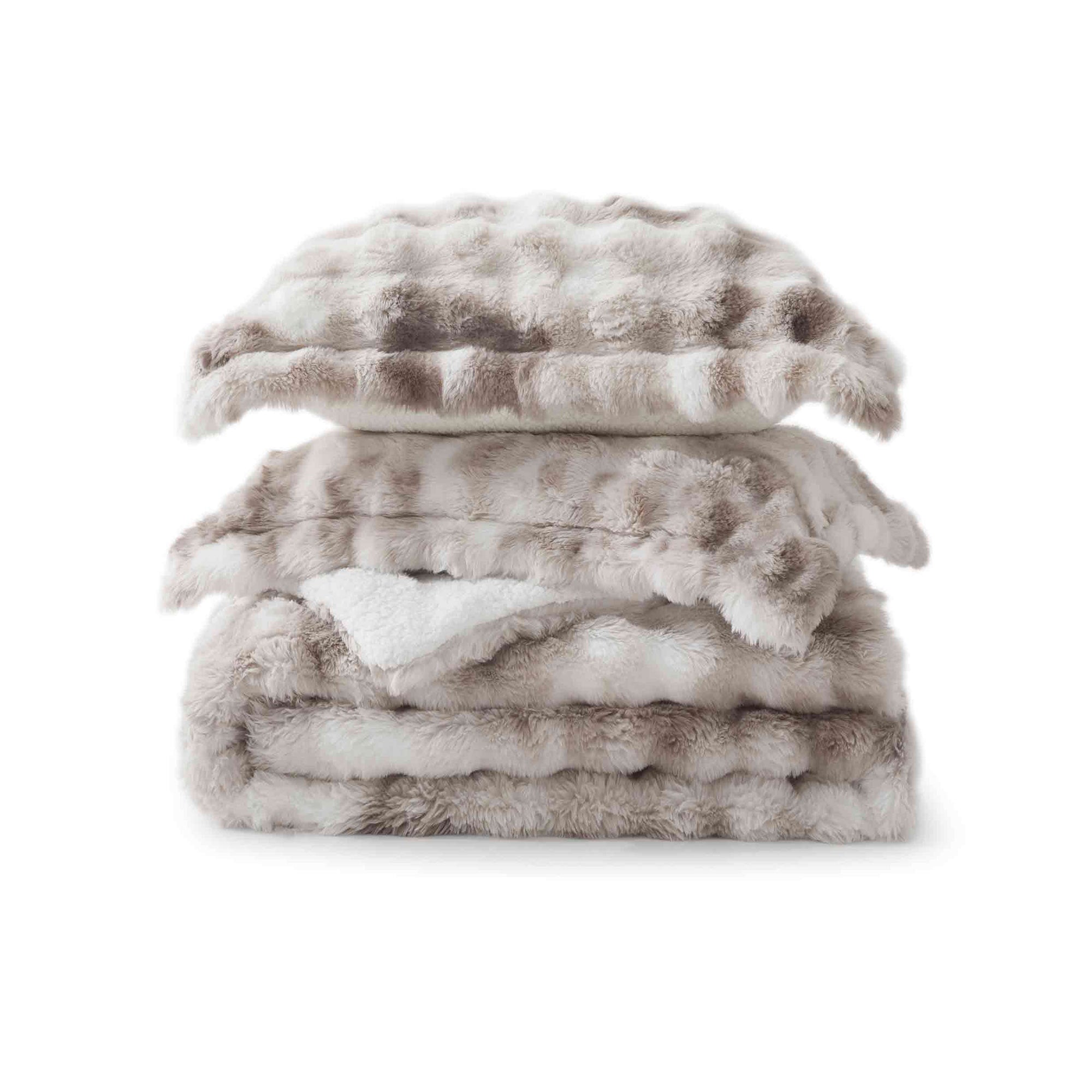 Soft Taupe offers cozy elegance for the cold season. This 3-piece reversible faux rabbit fur comforter set features an ultra-soft, velvety texture paired with a plush sherpa reverse, providing exceptional warmth and comfort during chilly nights. The soothing blend of beige and gray tones adds a touch of sophistication to any bedroom, making it the perfect choice for a stylish, snug winter retreat.