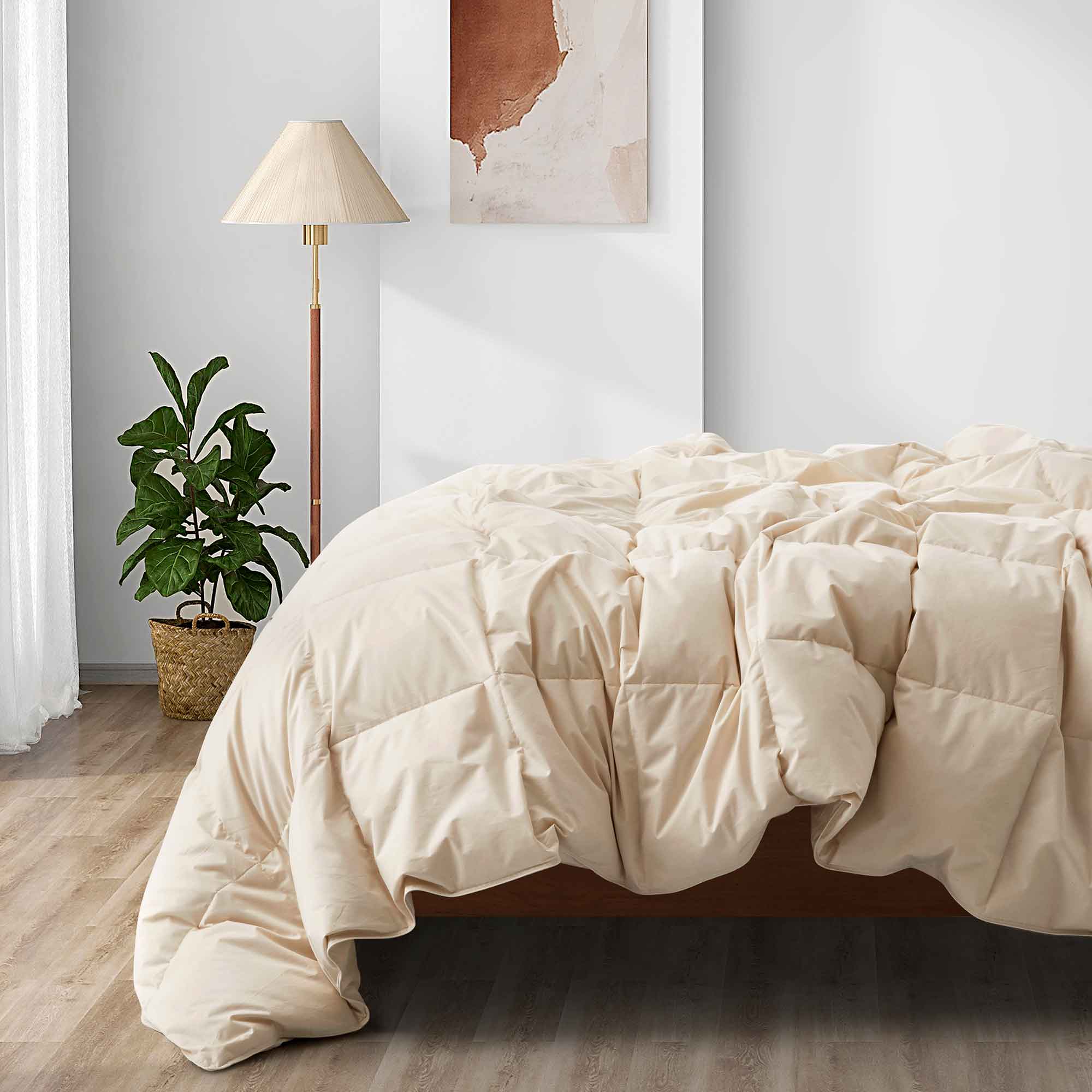 Embrace a luxurious, comfortable sleep every night with the Puredown All Season Organic Cotton Down Feather Fiber Comforter. The duvet insert can be attached to your duvet cover with ease, thanks to the four corner loops. Double-needle stitching coupled with elegant piping that lines the feather and down comforter ensures a sturdy seam, reducing duvet filling loss and lending the all-season feather comforter a tailored appearance.