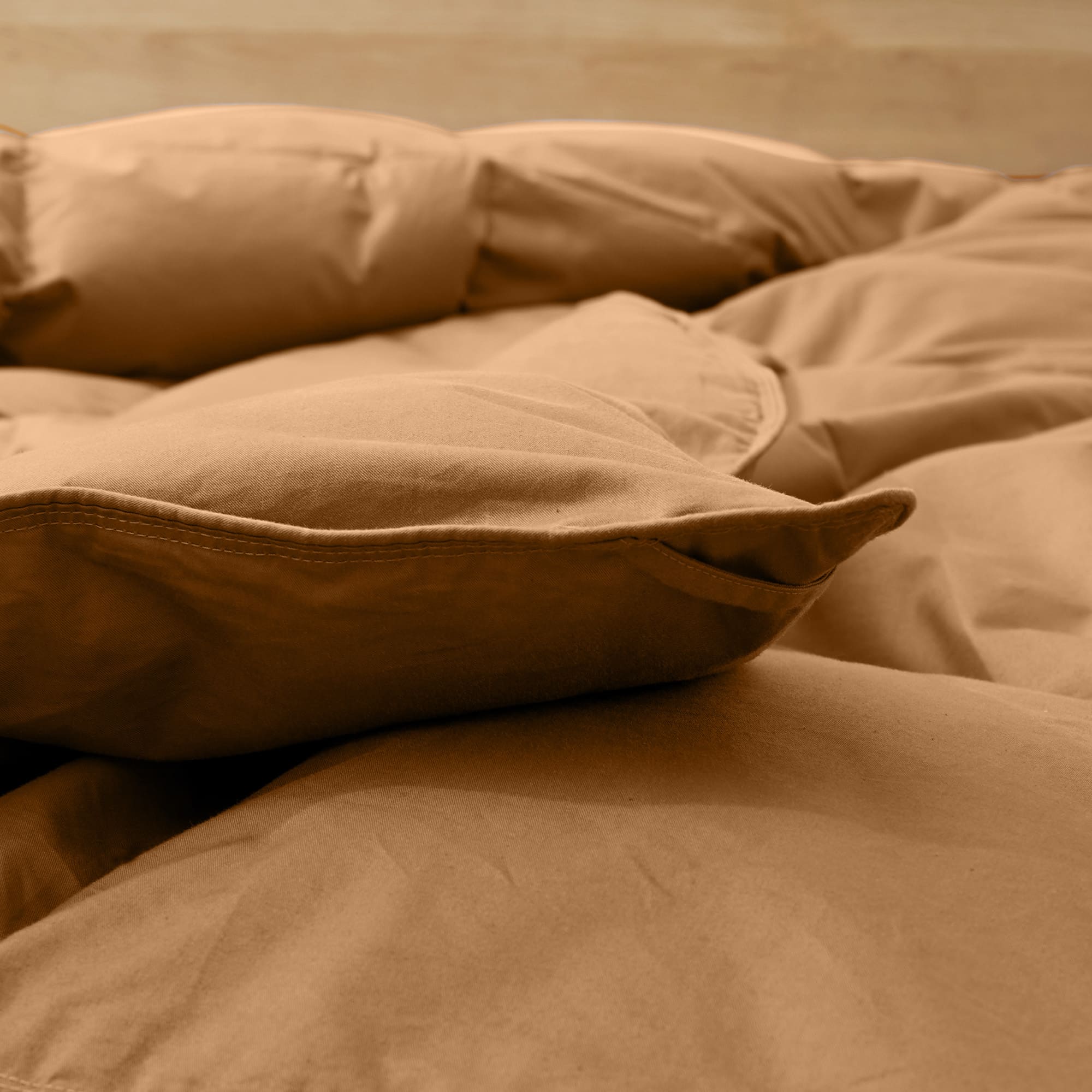 Wrap yourself in the earthy warmth of our Fawn Organic Cotton Down Comforter. This neutral beige comforter is designed with a natural GOTS-certified organic cotton shell and filled with plush, responsibly sourced down and feather fiber for breathable comfort year-round. The fawn tone adds a cozy, grounding presence to any bedroom, making it an ideal choice for those who love warm neutrals and organic, sustainable bedding that soothes both body and mind.
