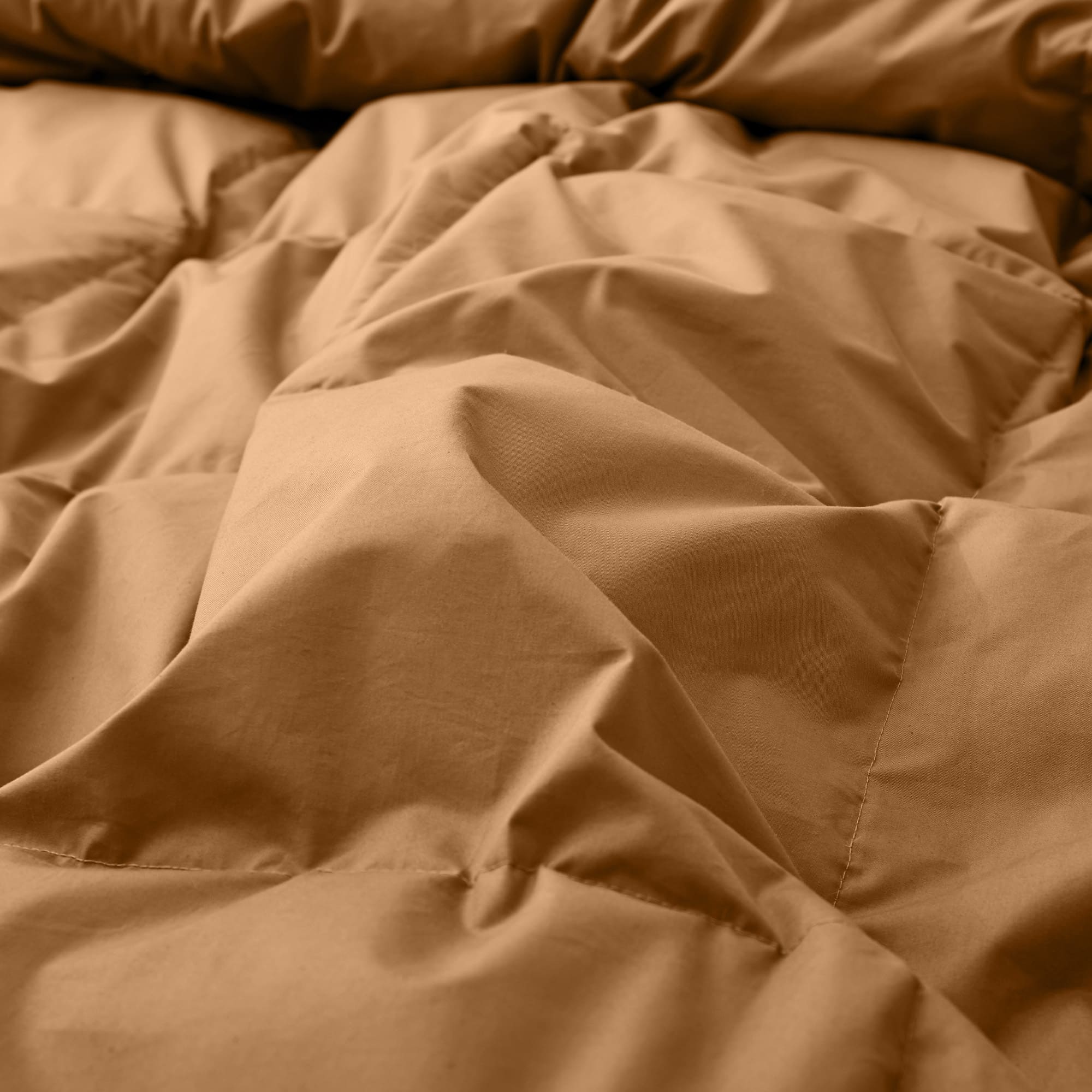 Wrap yourself in the earthy warmth of our Fawn Organic Cotton Down Comforter. This neutral beige comforter is designed with a natural GOTS-certified organic cotton shell and filled with plush, responsibly sourced down and feather fiber for breathable comfort year-round. The fawn tone adds a cozy, grounding presence to any bedroom, making it an ideal choice for those who love warm neutrals and organic, sustainable bedding that soothes both body and mind.