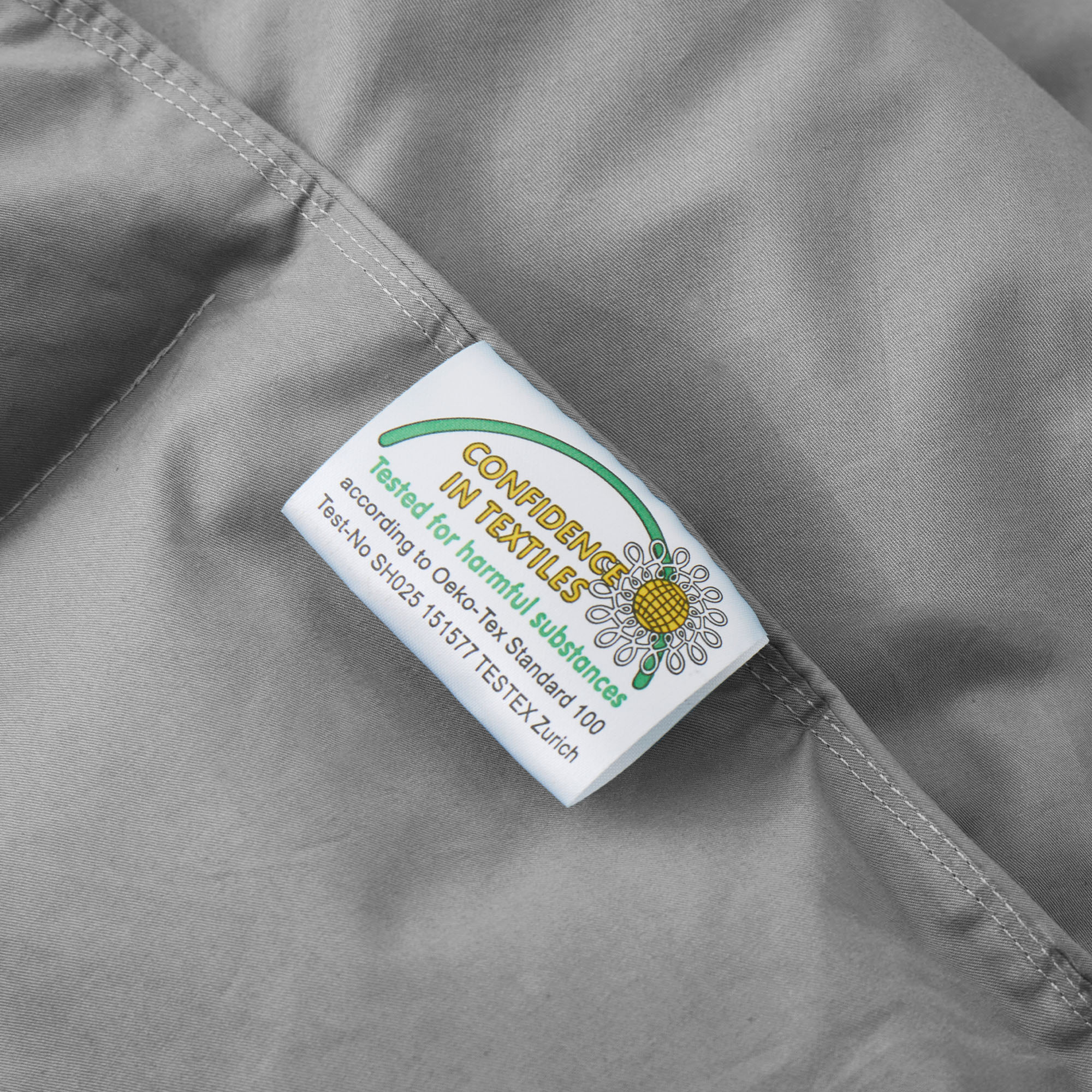 Indulge in the luxurious softness and durability of our organic comforter option in a versatile and chic gray shade, offering a cozy and sustainable way to enrich your sleep experience and enhance your bed in luxury style.