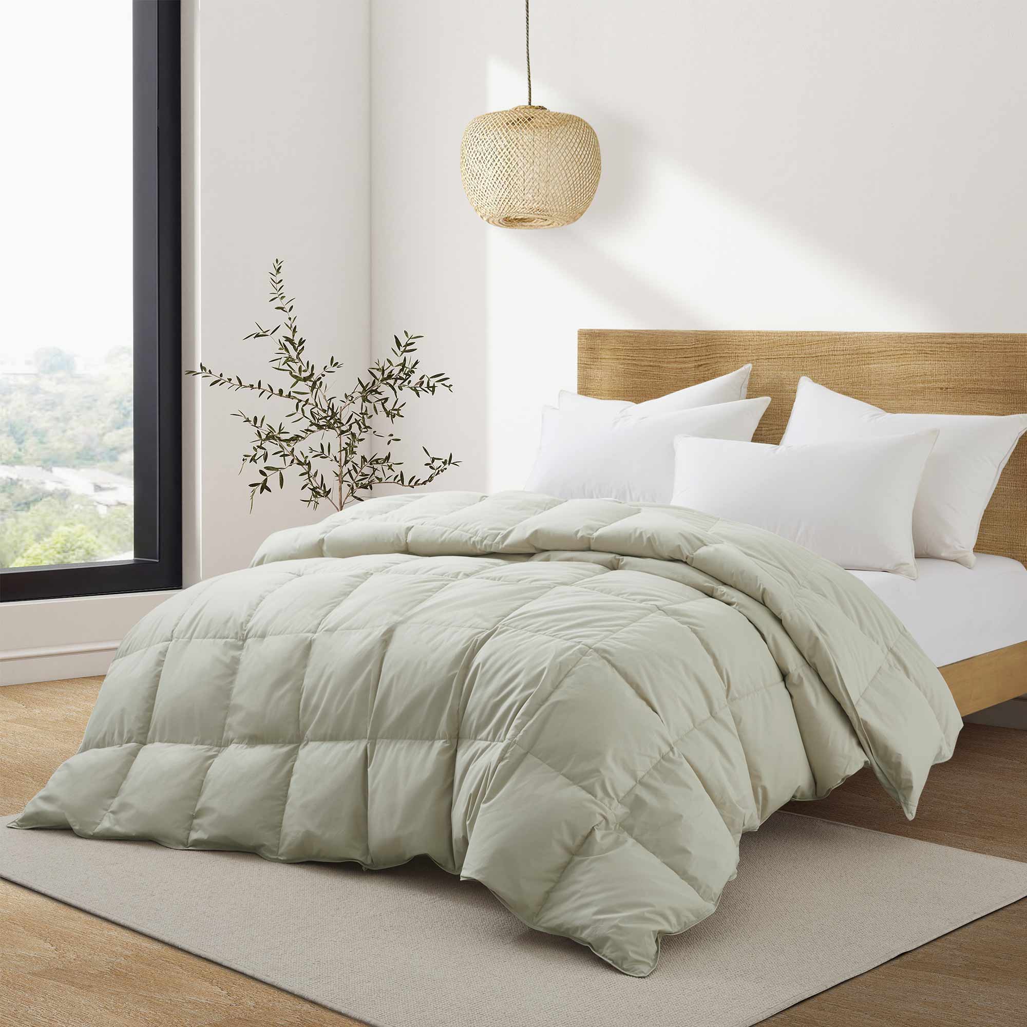 Add natural warmth and texture to your bedroom with our Oatmeal Organic Cotton Down Comforter. The soft, earthy oatmeal tone brings a calming, neutral aesthetic that blends effortlessly with modern, rustic, or minimalist decor. Made with GOTS-certified organic cotton and filled with 100% down and feather fiber, this comforter delivers breathable, all-season comfort with a cloud-like feel. Lightweight yet cozy, it's perfect for year-round use, offering natural insulation and moisture-wicking properties to he