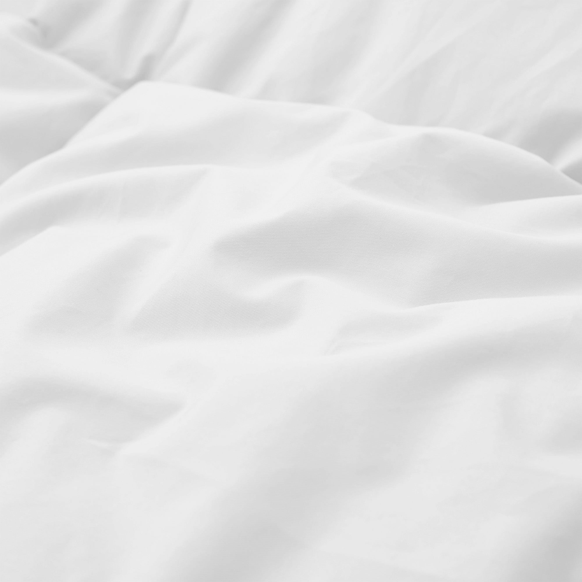 Experience timeless comfort with our White Organic Cotton Down Comforter — a must-have for those who value clean, classic bedding. Crafted from GOTS-certified organic cotton and filled with 100% down and feather fiber, this breathable and lightweight comforter is perfect for all-season use. The crisp white color creates a fresh, hotel-quality look while offering unmatched softness and natural temperature regulation. Whether styled alone or layered with other bedding, this white comforter elevates any bedroo