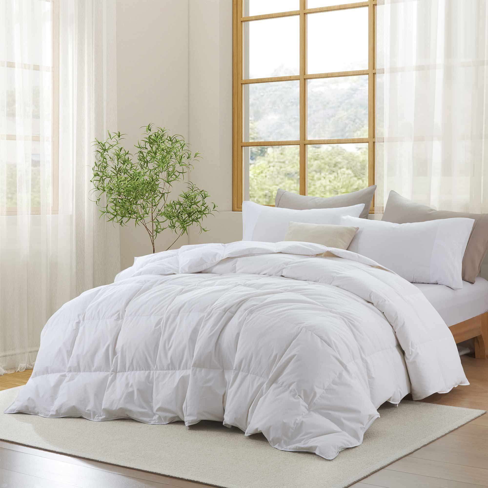 Experience timeless comfort with our White Organic Cotton Down Comforter — a must-have for those who value clean, classic bedding. Crafted from GOTS-certified organic cotton and filled with 100% down and feather fiber, this breathable and lightweight comforter is perfect for all-season use. The crisp white color creates a fresh, hotel-quality look while offering unmatched softness and natural temperature regulation. Whether styled alone or layered with other bedding, this white comforter elevates any bedroo